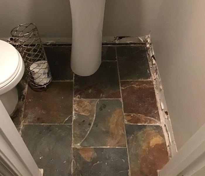 bathroom with tile floor, bathmat and molding removed