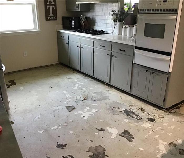 kitchen with flooring removed and SERVPRO equipment removed