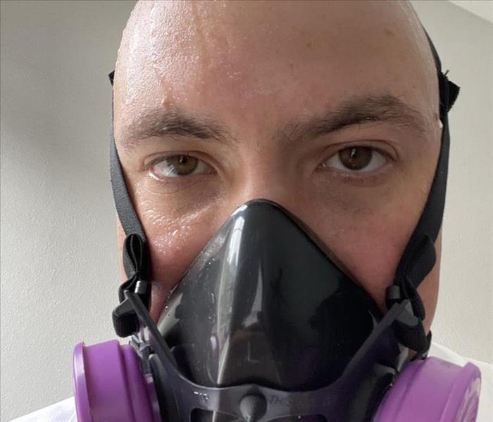 Production Manager Sean Gray in PPE used during a COVID Cleaning