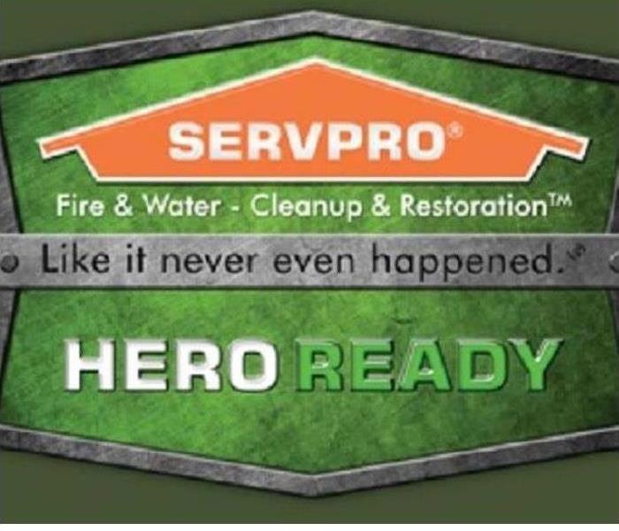 SERVPRO® Heroes scaling a sign 